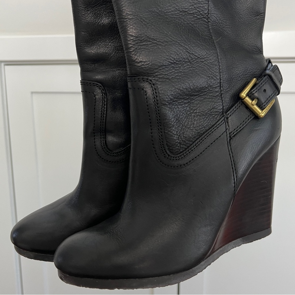My favorite knee-high Coach wedge boots that no longer fit after I had a baby